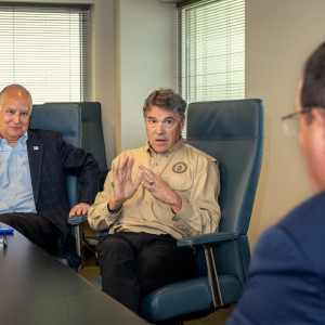 Secretary of Energy Rick Perry conversed with TECO's Board Chair Brad Howell, left, and TECO President and CEO Steve Swinson, right.