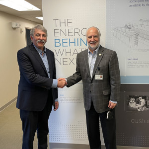 TECO's Chairman Brad Howell (right) congratulates Mike Manoucheri on his new role as TECO's president and CEO.