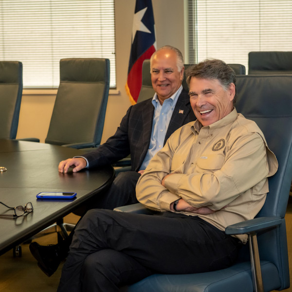 Secretary Perry during a visit to TECO as TECO Board Chair Brad Howell looked on.